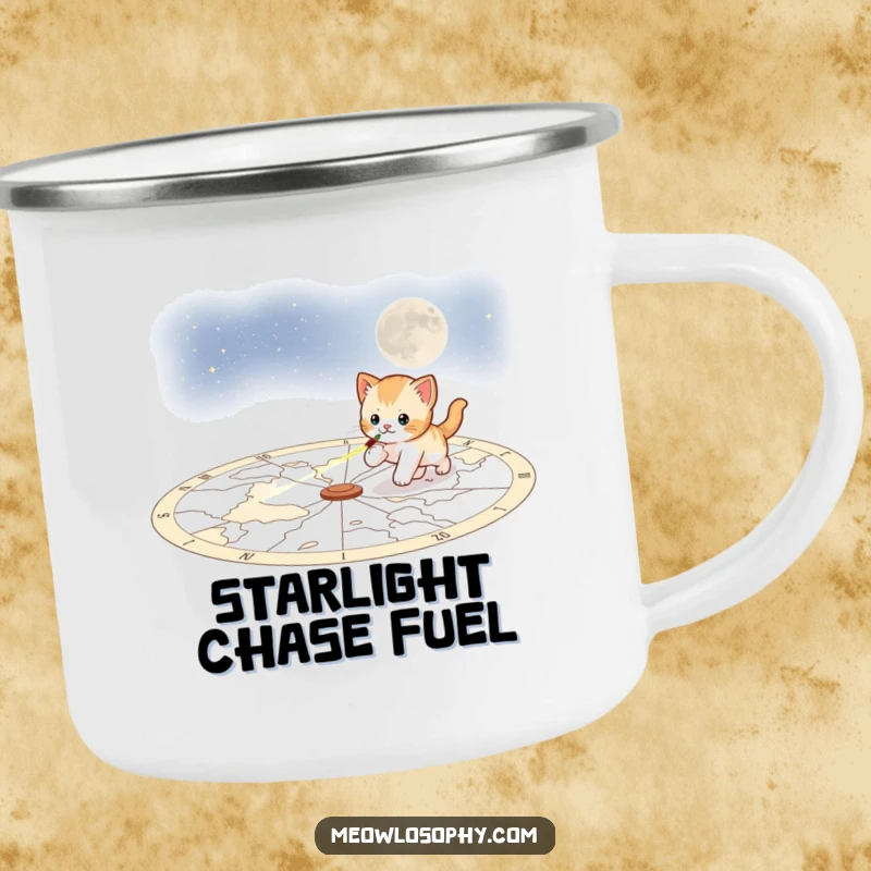 Funny playful kitten camping mug, showing a kitten chasing a laser pointer across a celestial map, ready for any celestial journey.