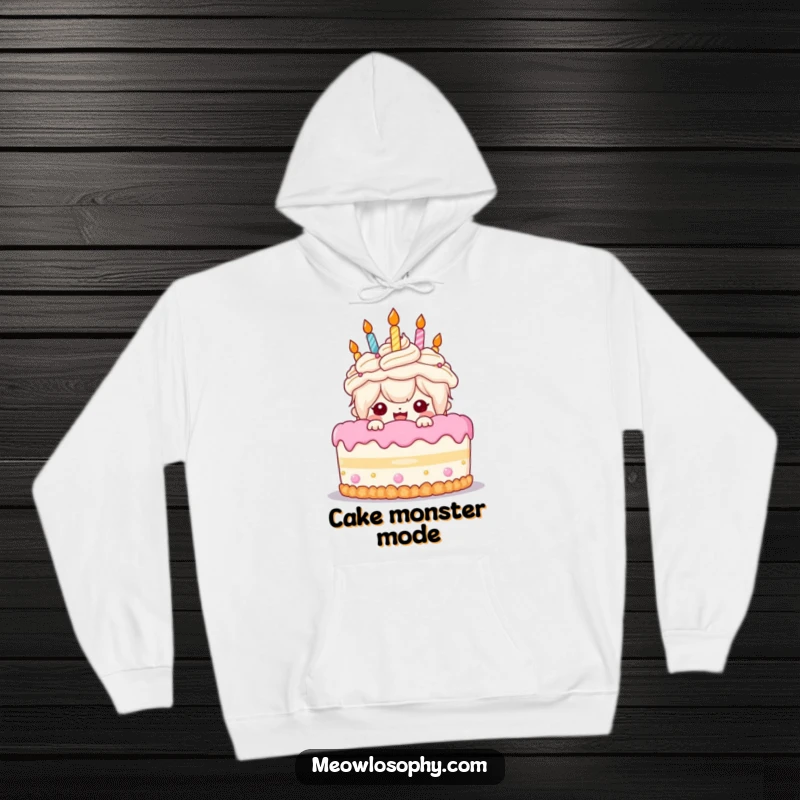 Funny Birthday Cake Hoodie: A cute kawaii character peeks with excitement from behind a giant birthday cake, radiating joy.