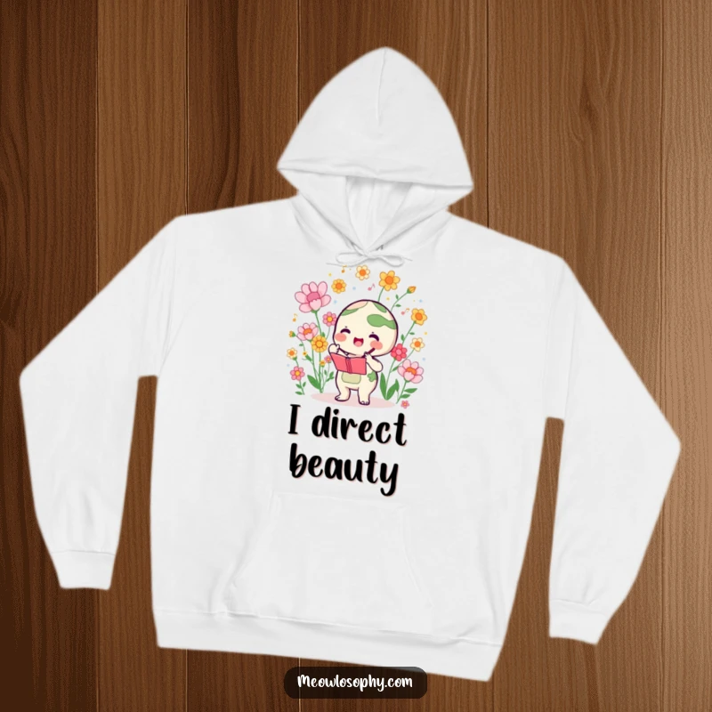 Funny hoodie with a cute earth character conducting a symphony of blooming flowers, offering cozy comfort and artistic harmony.