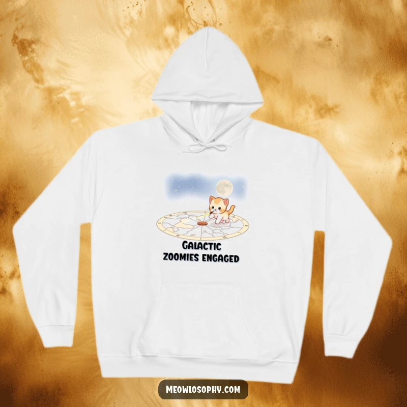 Funny playful kitten hoodie, showing a kitten chasing a laser pointer across a celestial map, combining comfort with cosmic fun.