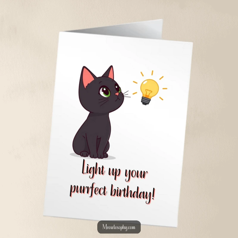 Funny Free Printable Birthday Card: Black cat marvels at a glowing lightbulb, a moment of genius for a DIY gift.