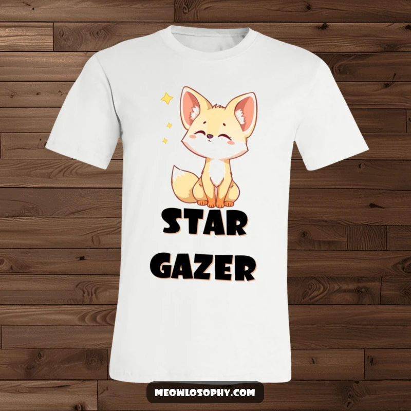 Funny Fennec Fox T-Shirt features a cute fox with ears cocked, looking up with wide, curious eyes at a shooting star.